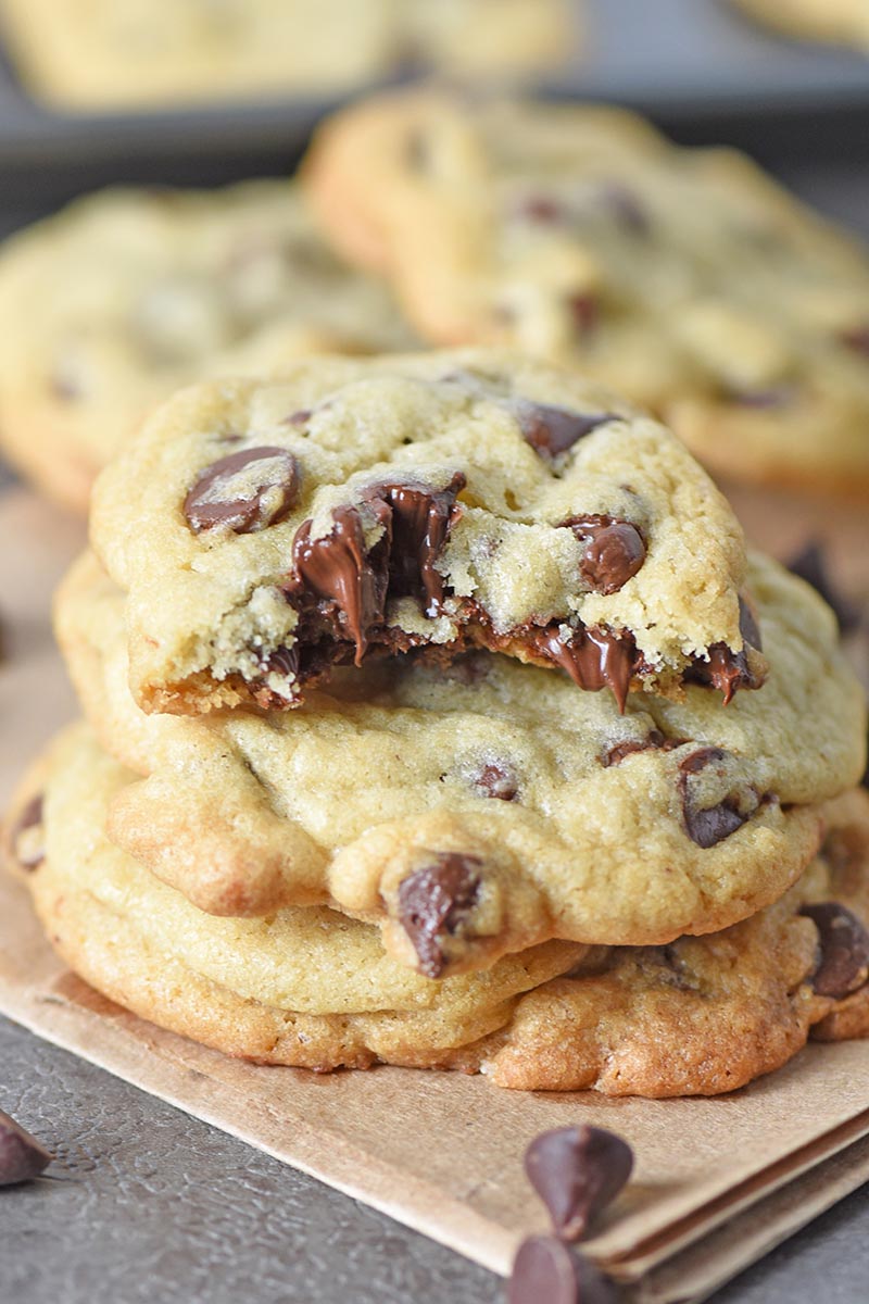 best chocolate chip cookies in a stack on a brown paper bag