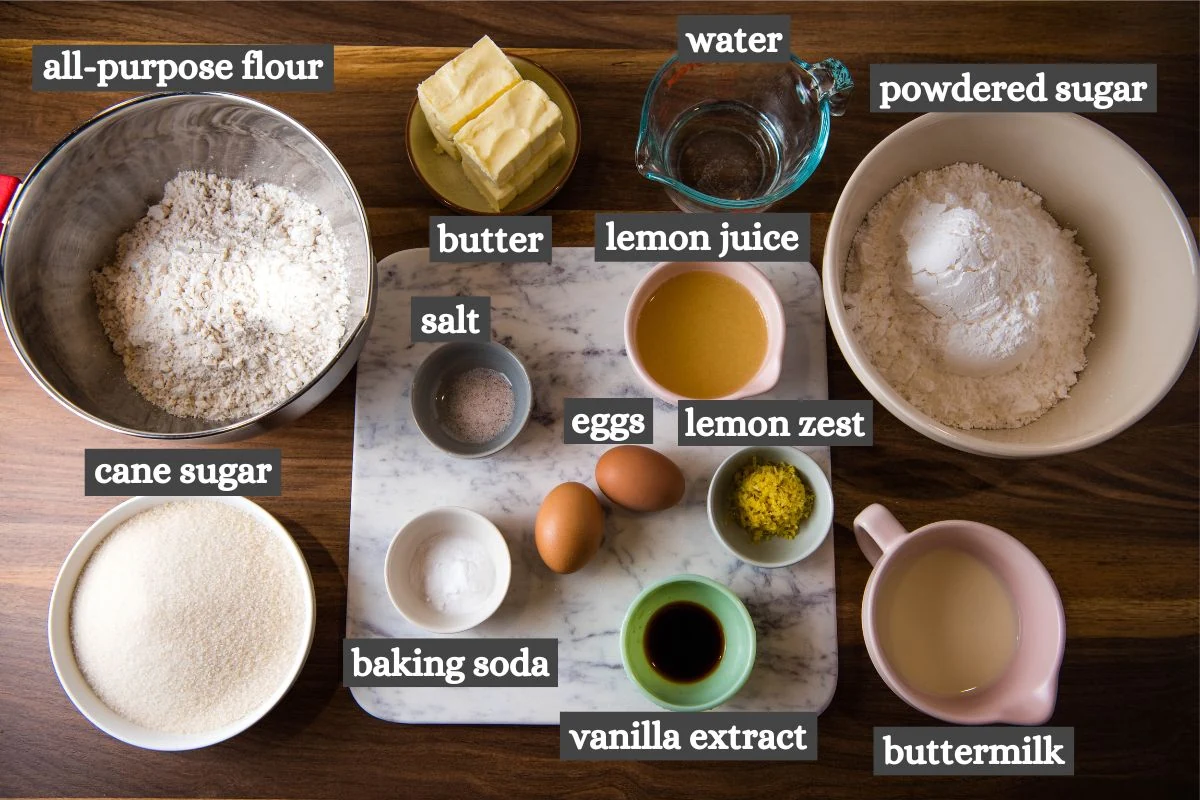 lemon Texas sheet cake ingredients lined out and labeled on a dark wooden countertop