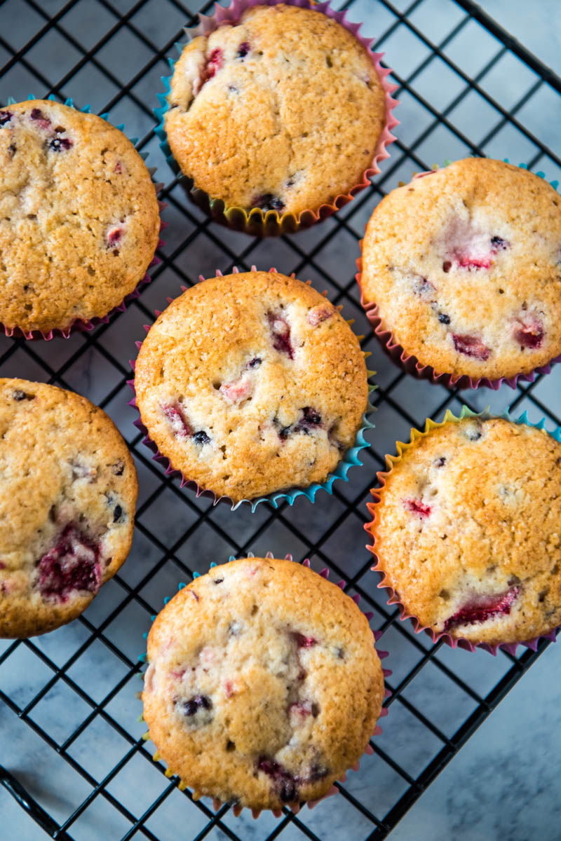 mixed berry muffins cooling on wire rack