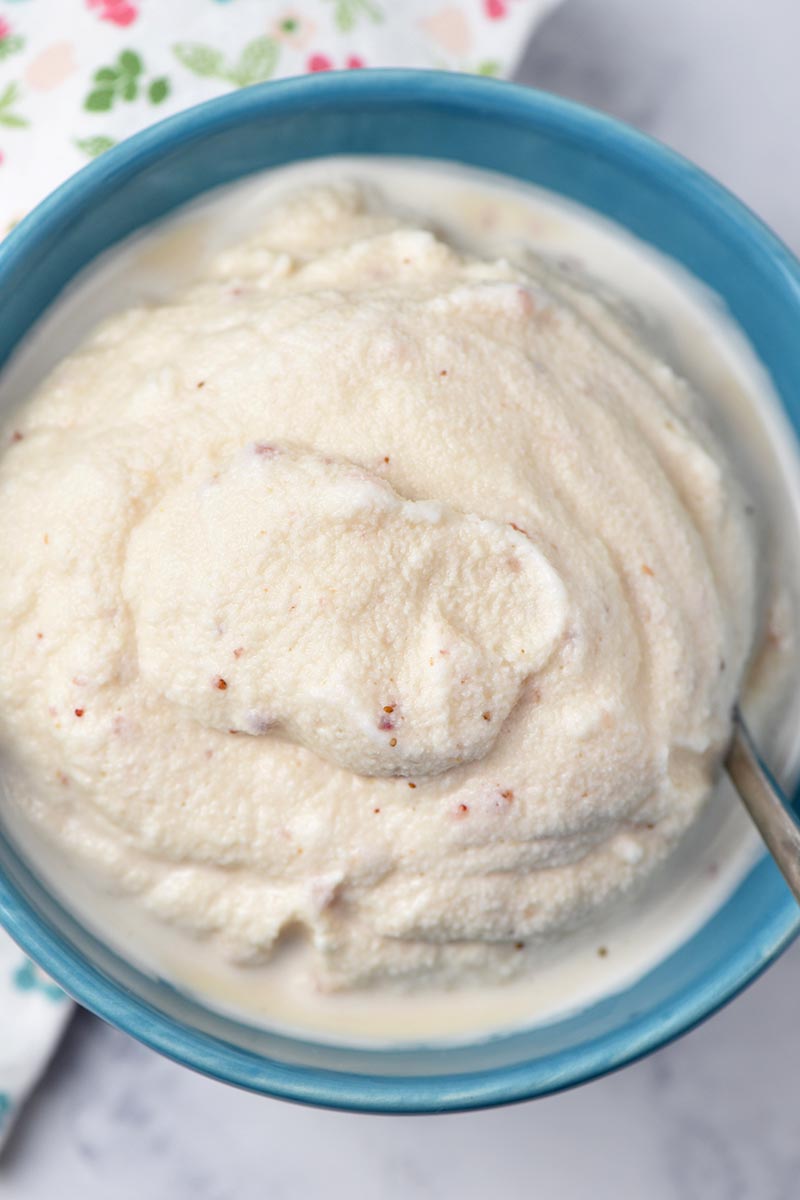 blue bowl of strawberry ice cream made the old-fashioned way