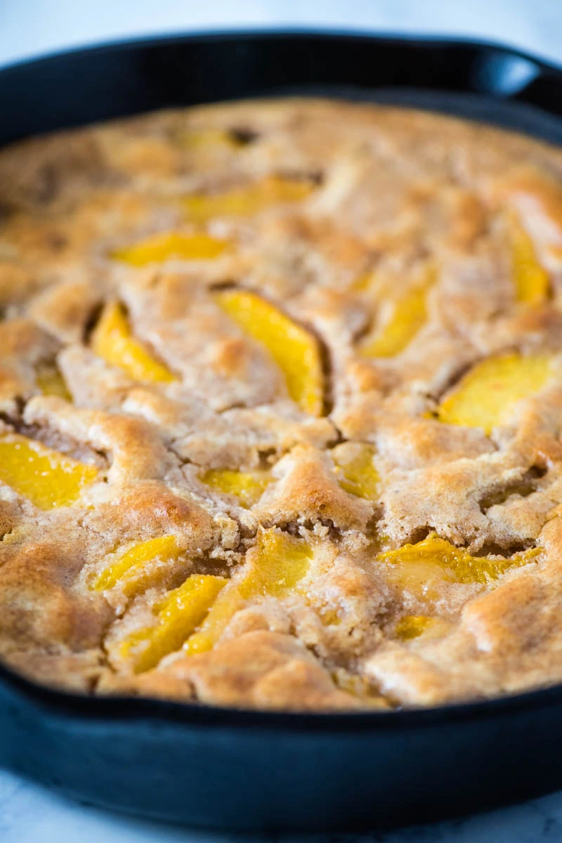 peach cobbler made with Bisquick in cast iron skillet