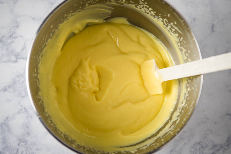 instant vanilla pudding in KitchenAid mixing bowl with spatula