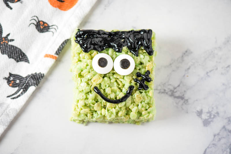 candy eyeballs added to green Frankenstein Rice Krispie treats