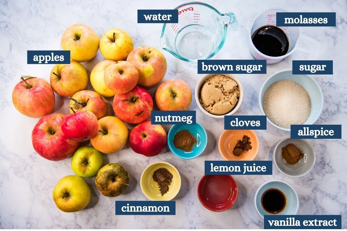 Instant Pot apple butter ingredients on white marble countertop