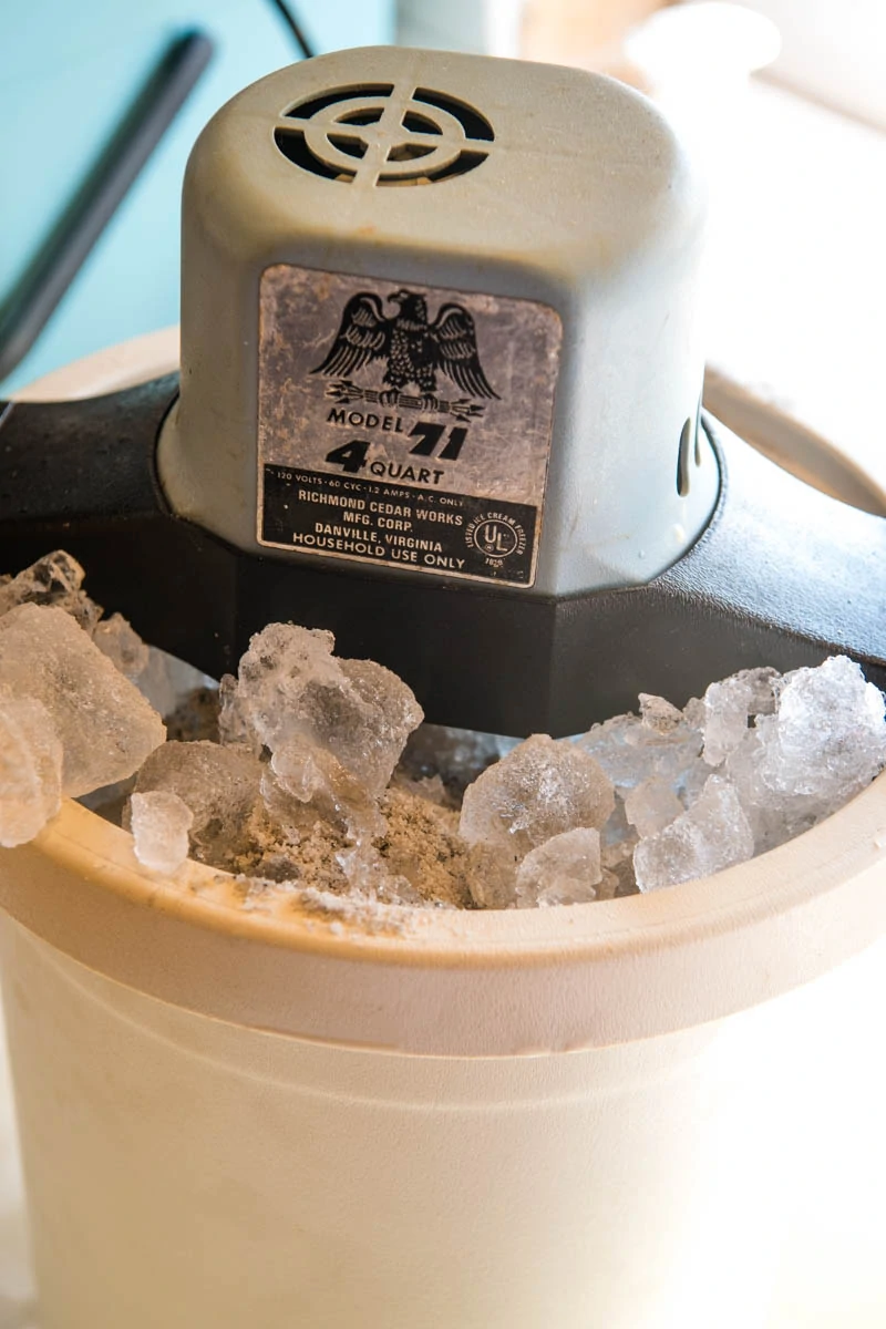 old ice cream maker filled with crushed ice and rock salt