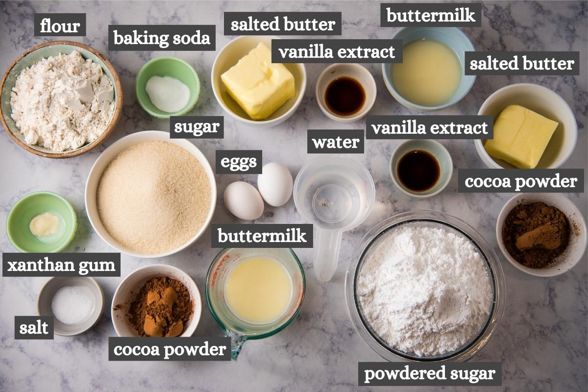 gluten-free chocolate sheet cake ingredients on white marble countertop