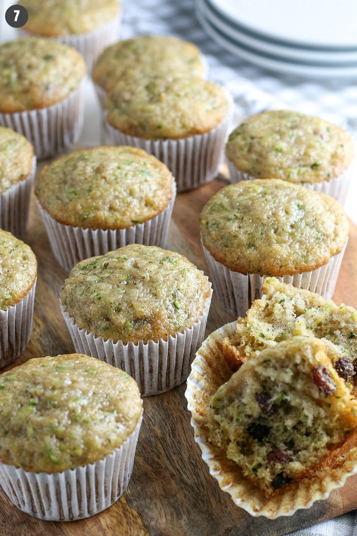 baked gluten-free dairy-free zucchini muffins cooling on wooden cutting board