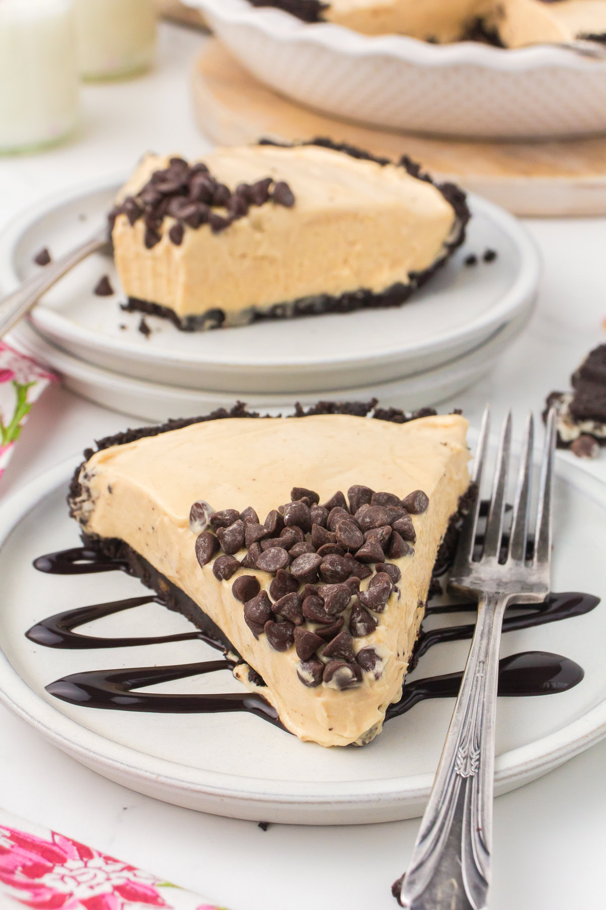 easy no bake peanut butter pie on a small gray decorative plate with mini chocolate chips on top