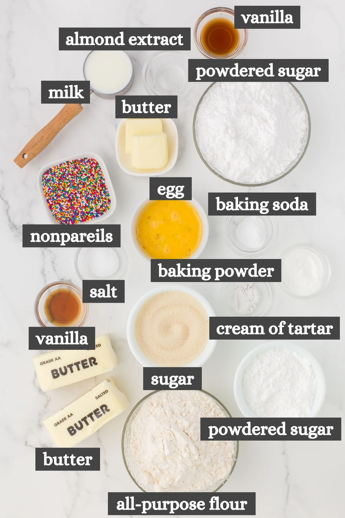 Italian sugar cookies ingredients lined out on a white countertop